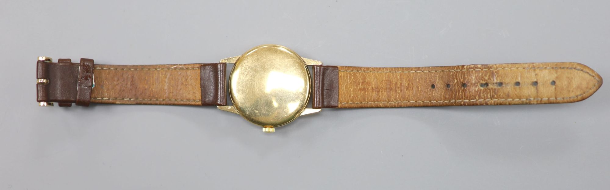 A gentlemans early 1960s 9ct gold Tudor Royal manual wind wrist watch, on associated leather strap,